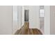Hallway with wood floors, access to bathroom and bedroom at 88 Molly Mac Ln, Angier, NC 27501