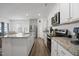 Bright, modern kitchen with stainless steel appliances, granite countertops, and an open layout at 88 Molly Mac Ln, Angier, NC 27501