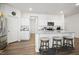 Bright kitchen with granite countertops, stainless steel appliances, and seating at the center island at 88 Molly Mac Ln, Angier, NC 27501
