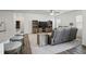 Cozy open-concept living space with a modern kitchen, plush seating, and wood-style flooring at 88 Molly Mac Ln, Angier, NC 27501