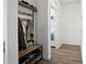 Functional mudroom featuring a coat rack, bench and easy access to the laundry room at 88 Molly Mac Ln, Angier, NC 27501