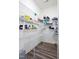 Walk-in pantry providing ample storage with wire shelving and hardwood floors at 88 Molly Mac Ln, Angier, NC 27501
