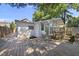 Charming backyard featuring a wooden deck connecting the main house and additional structure at 905 N Hyde Park Ave, Durham, NC 27701