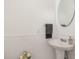 Well-lit bathroom featuring a pedestal sink, subway tile backsplash, and a round mirror at 905 N Hyde Park Ave, Durham, NC 27701