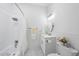 Bright bathroom featuring white tile, modern fixtures, and stylish decor accents at 905 N Hyde Park Ave, Durham, NC 27701