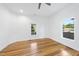 Airy bedroom with hardwood floors and two windows, creating a bright and welcoming atmosphere at 905 N Hyde Park Ave, Durham, NC 27701
