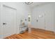 Bright foyer with gleaming hardwood floors, white trim and a charming console table at 905 N Hyde Park Ave, Durham, NC 27701