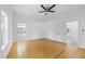 Main bedroom featuring hardwood floors and access to a closet and bathroom at 905 N Hyde Park Ave, Durham, NC 27701