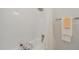All-white shower and tub combination with tiled walls and rainfall shower head at 905 N Hyde Park Ave, Durham, NC 27701