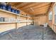 Unfinished storage with exposed framing, shelving, and a toilet, offering potential for customization at 905 N Hyde Park Ave, Durham, NC 27701