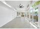 Spacious sunroom with tile floors, plenty of windows, and access to the outdoor decks at 905 N Hyde Park Ave, Durham, NC 27701
