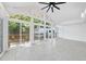 Well-lit sunroom featuring tile flooring, multiple windows, and access to outdoor decks at 905 N Hyde Park Ave, Durham, NC 27701