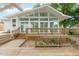 Stunning sunroom with expansive windows and a spacious wooden deck at 905 N Hyde Park Ave, Durham, NC 27701