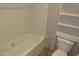 Bathroom with a shower-tub combo, toilet, and built-in shelving at 9115 Nc 157, Rougemont, NC 27572