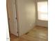View of a bedroom showing the walls, door and window with blinds at 9115 Nc 157, Rougemont, NC 27572