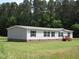 Charming single-story home with gray siding, black shutters, and well-manicured lawn at 9115 Nc 157, Rougemont, NC 27572