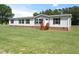 Charming single-story home featuring a well-maintained lawn and classic design at 9115 Nc 157, Rougemont, NC 27572