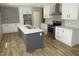 Spacious kitchen featuring gray cabinets, stainless steel appliances, and a modern design at 9115 Nc 157, Rougemont, NC 27572
