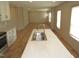 Open kitchen featuring a center island with a sink and stainless steel appliances at 9115 Nc 157, Rougemont, NC 27572