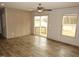 Bright living room featuring hardwood floors, a ceiling fan, and a sliding glass door at 9115 Nc 157, Rougemont, NC 27572