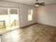 Spacious living room featuring wood-look floors and sliding glass doors to a small deck at 9115 Nc 157, Rougemont, NC 27572