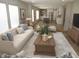 Open-concept living room features a stylish couch, hardwood floors, and seamless flow to the kitchen area at 9115 Nc 157, Rougemont, NC 27572