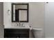 Modern bathroom featuring a marble vanity, sleek fixtures, and a tiled shower at 9413 Lake Villa Way, Raleigh, NC 27614