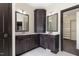 Elegant bathroom featuring double vanities, granite countertops, and custom cabinets at 9413 Lake Villa Way, Raleigh, NC 27614