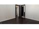 Spacious bedroom with dark hardwood floors and multiple doorways at 9413 Lake Villa Way, Raleigh, NC 27614
