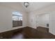 A bedroom with vaulted ceilings offers natural light from a window and a nearby entry door at 9413 Lake Villa Way, Raleigh, NC 27614