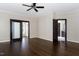 Spacious bedroom with hardwood flooring, elegant trim, and multiple doorways at 9413 Lake Villa Way, Raleigh, NC 27614