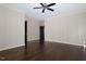 Bedroom features hardwood floors, white trim, and paneled walls at 9413 Lake Villa Way, Raleigh, NC 27614