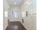 Inviting entryway showcasing a decorative glass front door and pristine white trim at 9413 Lake Villa Way, Raleigh, NC 27614