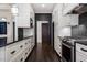 Updated kitchen features custom cabinets, granite countertops, and stainless steel appliances at 9413 Lake Villa Way, Raleigh, NC 27614
