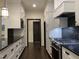 Beautiful kitchen with stainless steel appliances, white cabinetry, and granite countertops at 9413 Lake Villa Way, Raleigh, NC 27614