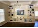 Bright living room boasts hardwood floors, a decorative chandelier, and a built-in bookshelf at 9413 Lake Villa Way, Raleigh, NC 27614