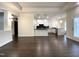 Bright, open living room with hardwood floors and access to the modern kitchen at 9413 Lake Villa Way, Raleigh, NC 27614