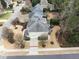 Aerial view of a gray roof home featuring well-maintained backyard landscaping at 100 Tavernelle Pl, Cary, NC 27519