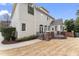 Backyard view of the house featuring a patio with black iron railing at 100 Tavernelle Pl, Cary, NC 27519