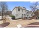 Expansive backyard view featuring patio area and well-maintained landscaping at 100 Tavernelle Pl, Cary, NC 27519