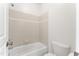 Cozy bathroom with a tiled tub-shower combination and classic fixtures at 100 Tavernelle Pl, Cary, NC 27519