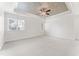 Bright bedroom with custom tray ceiling, carpet, and large windows at 100 Tavernelle Pl, Cary, NC 27519