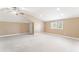 Large bonus room with neutral walls, carpet, and a window allowing natural light at 100 Tavernelle Pl, Cary, NC 27519