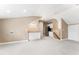 Spacious bonus room with kitchenette featuring cabinets and a sink at 100 Tavernelle Pl, Cary, NC 27519