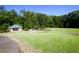 Serene community area featuring manicured lawns, a charming shelter, and a peaceful ambiance for relaxation and enjoyment at 100 Tavernelle Pl, Cary, NC 27519