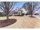 Beautiful home with a well-manicured lawn and inviting curb appeal at 100 Tavernelle Pl, Cary, NC 27519