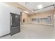 Spacious garage with ample storage cabinets and epoxy flooring at 100 Tavernelle Pl, Cary, NC 27519