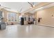 Well-organized garage featuring ample lighting, epoxy flooring, and storage solutions at 100 Tavernelle Pl, Cary, NC 27519