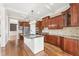 Gourmet kitchen with stainless steel appliances, granite countertops, and custom cabinets at 100 Tavernelle Pl, Cary, NC 27519