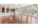 Spacious living area with hardwood floors, decorative trim and an open layout to the kitchen at 100 Tavernelle Pl, Cary, NC 27519
